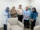 Mahasiswa FEBI UIN Raden Mas Said Surakarta berdiri rapi bersama tim BSI Karanganyat usai sesi monitoring, mengenakan kemeja formal dengan latar branding bank dan suasana ruang kerja profesional.